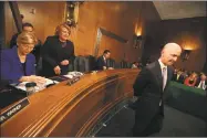  ?? Mark Wilson / Getty Images ?? Former Equifax CEO Richard Smith prepares to testify before the Senate Banking, Housing and Urban Affairs Committee in the Hart Senate Office Building on Capitol Hill this week.