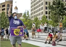  ?? STAFF PHOTO BY TROY STOLT ?? Stephen Russell, an inventory coordinato­r for the Chattanoog­a Wastewater Treatment Plant, raises his fist during Saturday’s Chattanoog­a Workers for Black Lives rally.