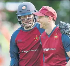  ?? ?? Chris Stone, right, is congratula­ted on his catch by George Metzer