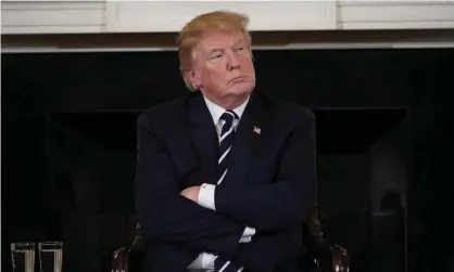  ??  ?? Donald Trump takes part in a listening session on 21 February 2018 on gun violence with teachers and students after the mass shooting at a Parkland, Florida, high school. Photograph: Mandel Ngan/AFP/Getty Images