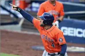  ?? The Associated Press ?? Houston Astros outfielder George Springer reacts after scoring on a single against the Tampa Bay Rays during Game 6 of the American League Championsh­ip Series, Oct. 16 in San Diego.