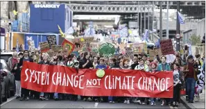  ?? ?? Top, Sepa is under investigat­ion over its ‘failure’ to stop sewage pollution
Above, a climate change march in Edinburgh
Picture: Neil Hanna/ Friends of the Earth