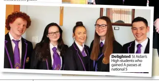  ??  ?? Delighted St Aidan’s High students who gained A passes at national 5