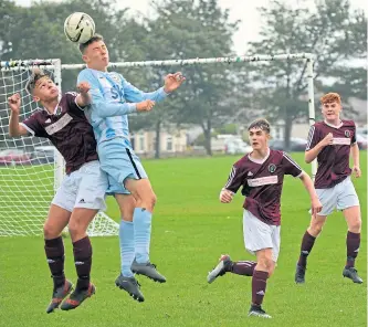  ??  ?? East Craigie Swifts (blue/white) beat North End 6-1 in an U/19 Scottish Cup second-round tie at Fairmuir.