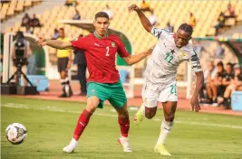  ?? /Gallo Images ?? Achraf Hakimi of Morocco and Thomas Partey of Ghana during their 2021 Africa Cup of Nations match.