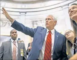  ??  ?? His future home? Vice President Mike Pence greets tourists at the Capitol.