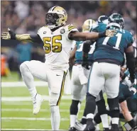  ?? Bill Feig / Associated Press ?? Saints outside linebacker Demario Davis celebrates a defensive stop in the first half of a 48- 7 victory against the Philadelph­ia Eagles in New Orleans in November.