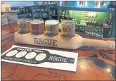  ?? IRIS YOKOI ?? Sample the varied beer offerings at Rogue Brewer’s on the Bay, which looks out on Yaquina Bay.