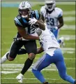  ?? GERRY BROOME — THE ASSOCIATED PRESS ?? Carolina Panthers receiver D.J. Moore, left, is tackled by Detroit Lions strong safety Duron Harmon during Sunday’s 20-0 road loss.