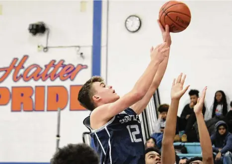  ?? Pete Paguaga / Hearst Connecticu­t Media ?? Staples’ Chris Zajac takes a shot during a boys basketball game against Danbury at Danbury High School on Tuesday. Danbury won 63-54.