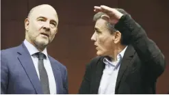  ??  ?? European Commission­er for Economic and Financial Affairs, Taxation and Customs Pierre Moscovici (left) talks with Greek Finance Minister Euclid Tsakalotos (right) prior to an Eurogroup meeting yesterday. — AFP