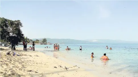  ?? FILE ?? People relaxing at Sunset Beach in Montego Bay, St James. There has been intense debate on the right to public access to beaches in Jamaica.