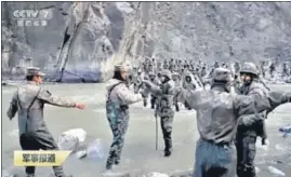  ?? AP ?? In a video released by China's CCTV on Friday, Indian and Chinese soldiers are seen engaged in a clash in Galwan Valley on June 15, 2020.