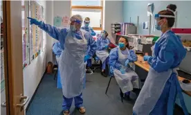  ??  ?? Nurses on a Covid-19 ward in Merseyside, north-west England. Healthcare workers and people most at risk will be prioritise­d for first doses of a vaccine. Photograph: Peter Byrne/PA