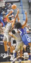  ?? Stephen Dunn / Associated Press ?? UConn’s Napheesa Collier (24) and Crystal Dangerfiel­d (5) battle for a rebound against Memphis' Brianna Porter (25) in the first half Sunday.