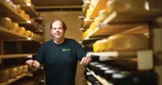  ?? LAUREN MILLER FOR THE TORONTO STAR ?? Owner and lead cheesemake­r Jeff McCourt stands in the cheese cave at Glasgow Glen Farm in New Glasgow, P.E.I.
