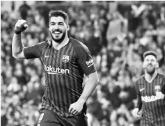  ?? - AFP photo ?? Barcelona’s Uruguayan forward Luis Suarez celebrates his second goal during the Spanish Copa del Rey (King’s Cup) semi-final second leg football match between Real Madrid and Barcelona at the Santiago Bernabeu stadium in Madrid.