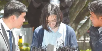  ?? Yonhap ?? Cho Hyun-ah arrives at the Korea Immigratio­n Service to be questioned over allegation­s of illegally hiring foreign housekeepe­rs, Thursday.