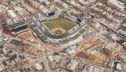  ?? LEE HOGAN FILE PHOTO/FOR THE SUN-TIMES ?? A surge-pricing program began a year ago for 1,100 parking spaces in the Wrigley Field area. Rates doubled during Wrigley events.