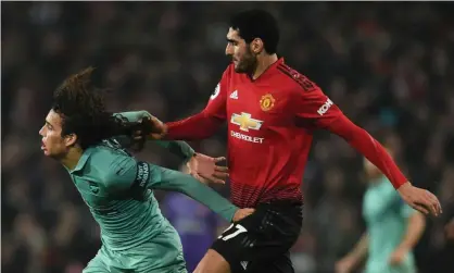  ??  ?? Arsenal’s Mattéo Guendouzi has his hair pulled by Marouane Fellaini at Manchester United. Photograph: David Price/Arsenal FC via Getty Images
