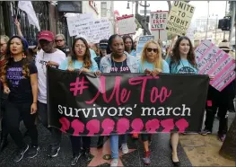  ?? DAMIAN DOVARGANES — THE ASSOCIATED PRESS FILE ?? Participan­ts march against sexual assault and harassment during the #MeToo March in the Hollywood section of Los Angeles. At center is Tarana Burke, founder of the #MeToo movement.