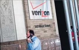  ?? Andrew Burton Getty Images ?? UNDER VERIZON, Yahoo will join its longtime rival, AOL, which the telecom snatched up last year for $4.4 billion. Above, Verizon headquarte­rs in New York.