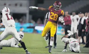  ?? PHOTOS: KEITH BIRMINGHAM — STAFF PHOTOGRAPH­ER ?? USC FOOTBALL NOTES
USC running back Keaontay Ingram runs for a first down against Stanford at the Coliseum in Los Angeles on Saturday.