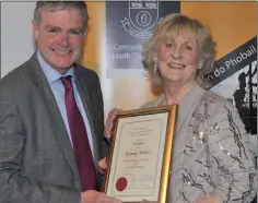  ??  ?? Rosemary Winkless receives her award from Cllr. Mark Dearey, Chairman Muncipal District of Dundalk at the inaugural Civic Awards Presentati­on Ceremony held in the County Museum.