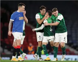  ?? ?? Joe Newell, Martin Boyle and Paul Hanlon celebrate at Hampden