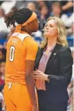  ?? AP PHOTO/JESSICA HILL ?? Tennessee women’s basketball coach Kellie Harper, right, talks with Rennia Davis during the first half Thursday night.