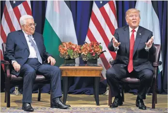  ?? BRENDAN SMIALOWSKI, AFP/GETTY IMAGES ?? President Trump meets with Palestinia­n leader Mahmoud Abbas.