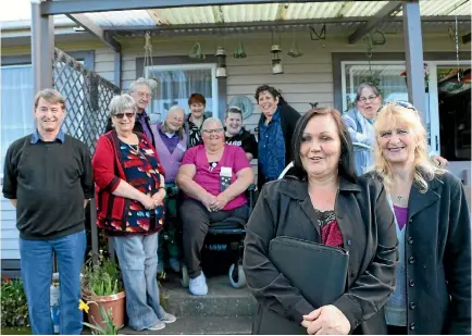  ?? CATHERINE GROENESTEI­N/STUFF ?? Suzanne Taylor and Dianne Grigg (front, right) from the new South Taranaki Passengers Services Society with committee members of the Taranaki branch of the Disabled Persons Assembly.