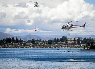 ?? PHOTO: GEORGE HEARD/STUFF ?? A Chilean tourist forfeited his drone after being convicted of flying it too close to helicopter­s fighting a large fire near Wanaka last month.