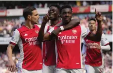  ?? AP ?? Arsenal attacker Eddie Nketiah celebrates with teammates after scoring in their victory over Leeds United yesterday