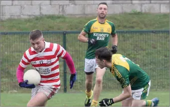  ??  ?? Ryan Nolan of Ferns St. Aidan’s stealing a march on HWH-Bunclody defender Billy Kelly.