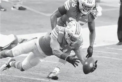  ?? WILFREDO LEE/AP ?? Dolphins linebacker Kamu Grugier-Hill recovers a fumble against the Chiefs on Dec. 13 at Hard Rock Stadium.