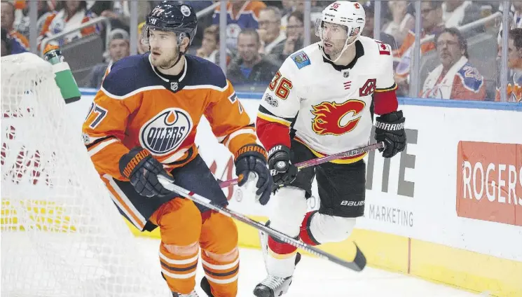  ?? CODIE MCLACHLAN/GETTY IMAGES ?? Oilers blue-liner Oscar Klefbom, left, was at his offensive best with nine shots on goal in Edmonton’s 3-0 win over Calgary in Wednesday’s opener.