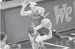  ?? MICHAEL LAUGHLIN/SOUTH FLORIDA SUN SENTINEL ?? The Heat’s Goran Dragic is fouled by the Lakers’ Alex Caruso during the first half of Thursday night’s game.