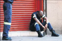  ?? /PHOTOS/ MDUDUZI NDZINGI ?? Firefighte­rs shed tears after three of their colleagues died during the fire incident.