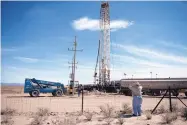  ?? ROBERTO E. ROSALES/JOURNAL ?? New Mexico rancher William Hurt waits at the border fence to talk to David Fehr, a member of the Mexican Mennonite community who was drilling a well for farmer Pedro Suderman.