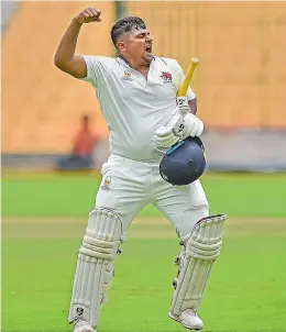  ?? — PTI ?? Mumbai’s Sarfaraz Khan celebrates after scoring a century against Madhya Pradesh on the second day of their Ranji Trophy final at the M. Chinnaswam­y Stadium in Bengaluru on Thursday.