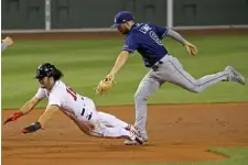  ?? STuART CAHILL / HeRALd sTAFF FILe ?? SEASON TO FORGET: Andrew Benintendi is tagged out in a rundown on Aug. 11 against the Rays. It was the last game he played because of a strained right rib cage. Benintendi was 4-for-39 with 17 strikeouts.