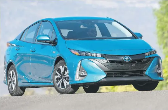  ?? TOYOTA ?? For 2017, Toyota’s rakishly good-looking Prius Prime can travel a full 35 km — and hit 135 km/h — on battery power alone and features much-improved handling characteri­stics.