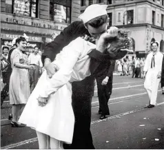  ?? U.S. NAVY ?? In this Aug. 14, 1945, file photo provided by the U.S. Navy, a sailor and a woman kiss in New York’s Times Square as people celebrate the end of World War II. The sailor, George Mendonsa, died Sunday.