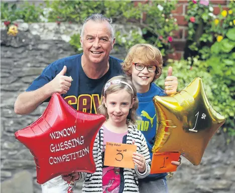  ??  ?? THE winners of Broughty Ferry Gala Week window competitio­n have been presented with their prizes.
The competitio­n, which started in 1932, sees members of Broughty Ferry Traders’ Associatio­n display an item in their window which they do not...