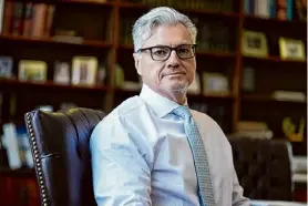  ?? Seth Wenig/associated Press ?? Judge Juan M. Merchan in his chambers in New York on March 14. Donald Trump will make history as the first former president to stand trial on criminal charges when his hushmoney case opens with jury selection Monday.