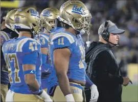  ?? Luis Sinco Los Angeles Times ?? UCLA IS PREPARING to move to the Big Ten in 2024 but some say Chip Kelly, right, should not be the football coach who leads the Bruins into that era.