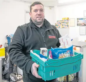  ??  ?? Gary Rooney with another basket of supplies ready for delivery.