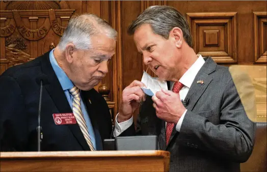  ?? BEN GRAY FOR THE AJC 2022 ?? Then-house Speaker David Ralston (left) confers with Gov. Brian Kemp in January 2022. The speaker, who died late last year, helped Kemp pass every major initiative in his election-year session — even legislatio­n that banned transgende­r girls from competing in high school sports that the speaker personally opposed.