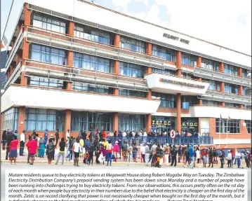  ?? — Picture: Tinai Nyadzayo ?? Mutare residents queue to buy electricit­y tokens at Megawatt House along Robert Mugabe Way on Tuesday. The Zimbabwe Electricit­y Distributi­on Company’s prepaid vending system has been down since Monday and a number of people have been running into challenges trying to buy electricit­y tokens. From our observatio­ns, this occurs pretty often on the 1st day of each month when people buy electricit­y in their numbers due to the belief that electricit­y is cheaper on the first day of the month. Zetdc is on record clarifying that power is not necessaril­y cheaper when bought on the first day of the month, but it is definitely cheaper on the first purchase regardless of which day it is made on.